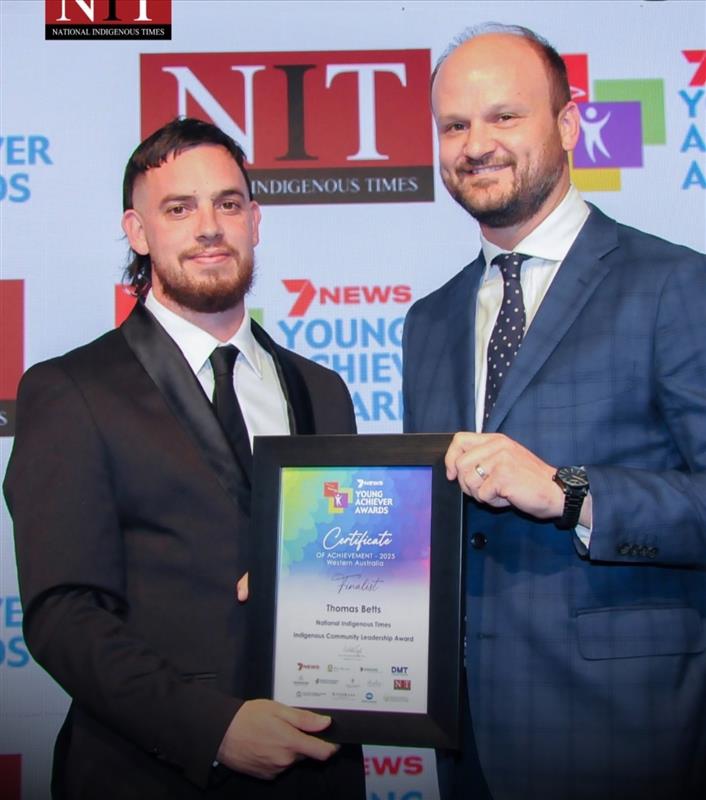 Thomas Betts with his award