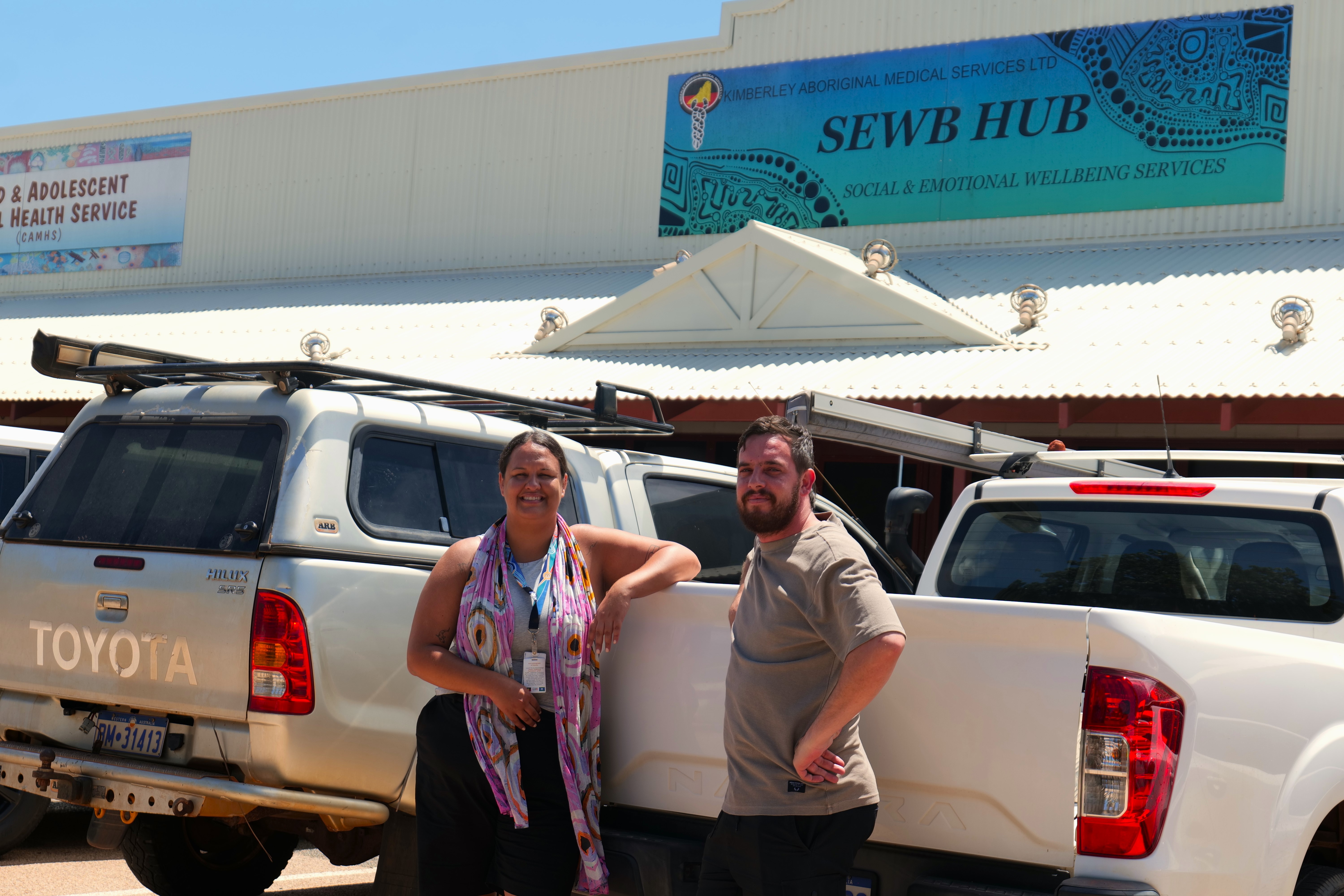 Aboriginal Project Officers Sarah Cattermole and Thomas Betts out the front of KAMS' SEWB Hub