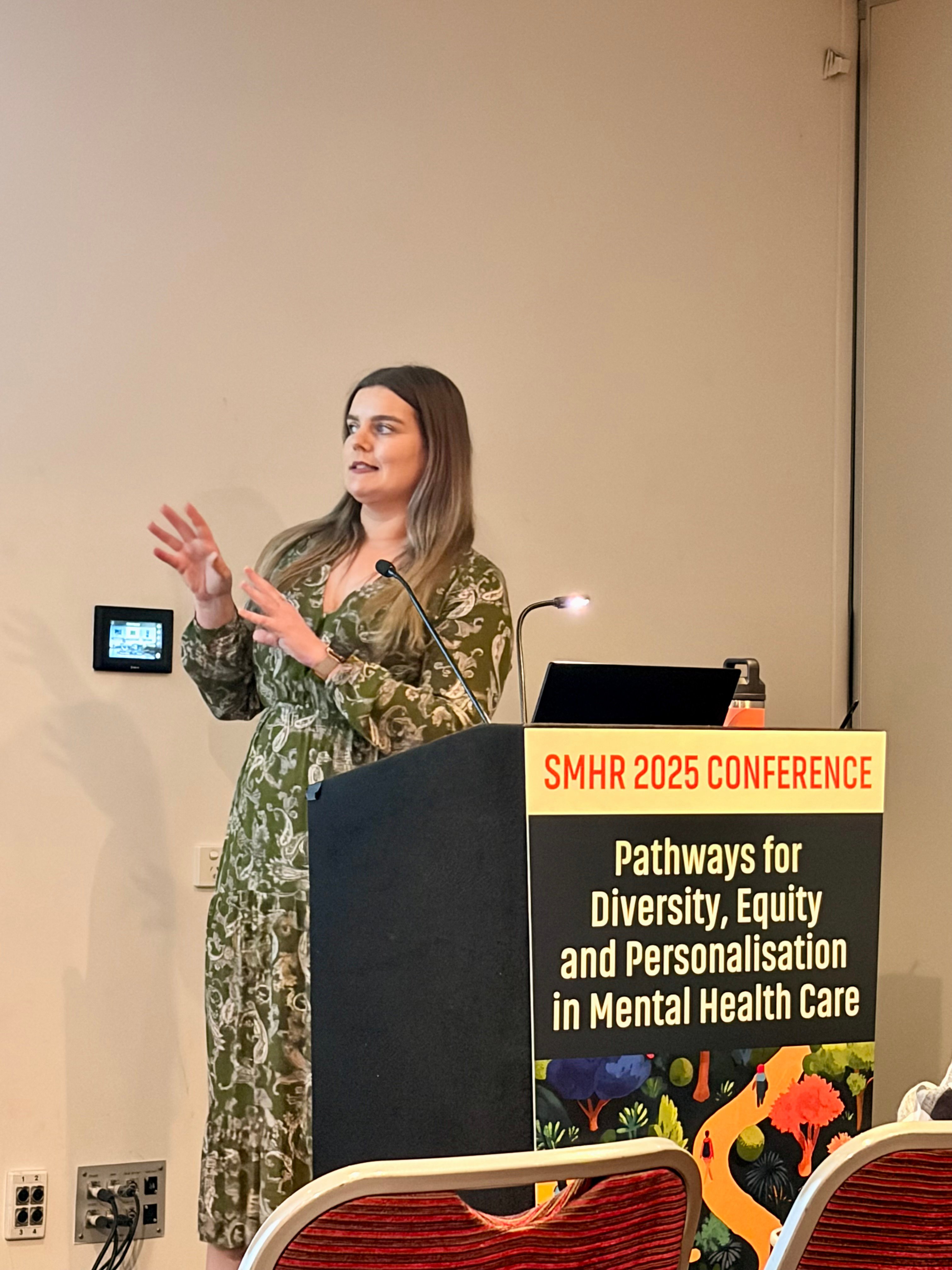 PhD candidate Katherine Murfitt presenting at SMHR in 2025.