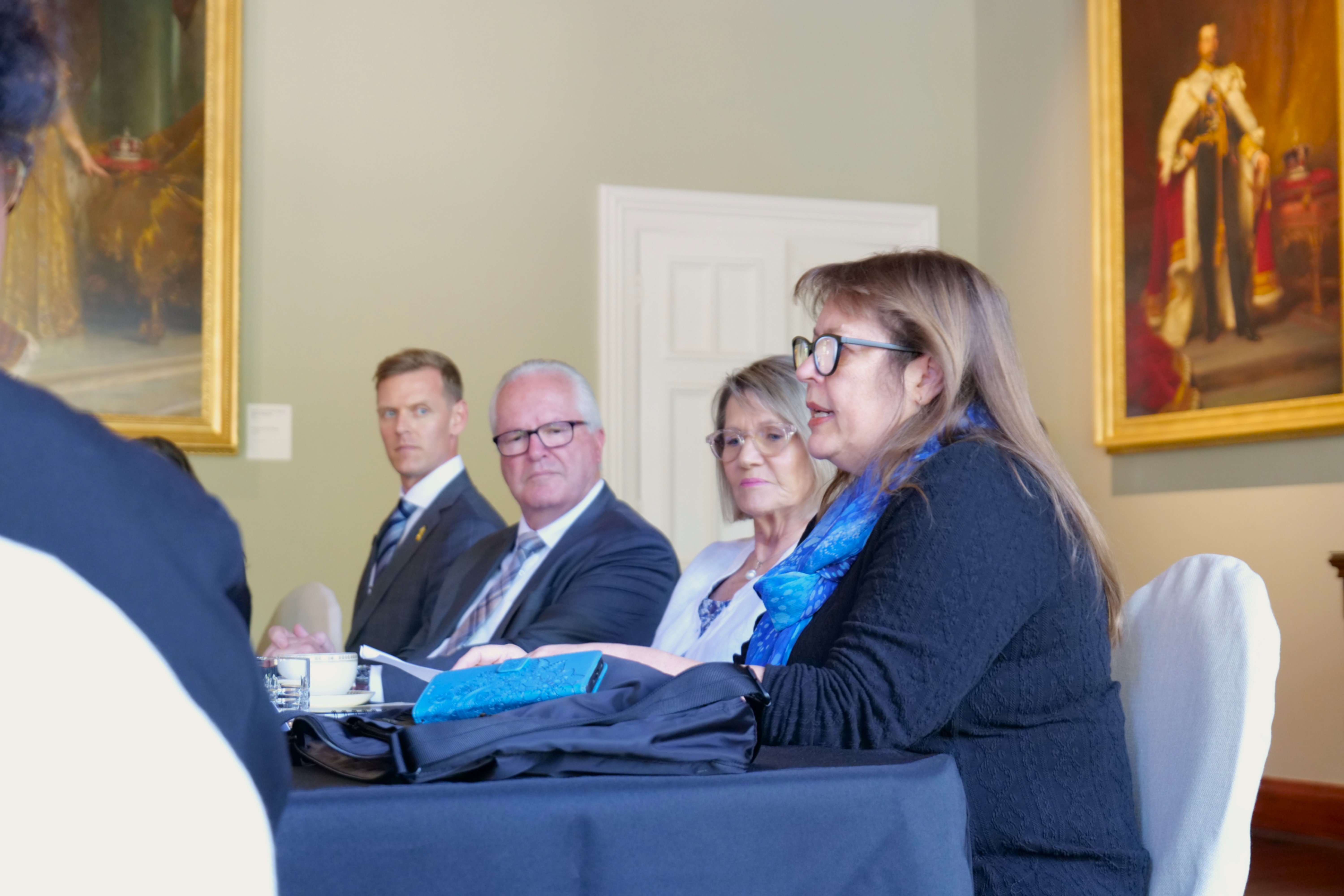 Professor Milroy discusses trauma-informed care as the Governor and Mrs Derrilyn Dawson look on.